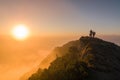 Tourists watching the sunrise at the top of the mountain Royalty Free Stock Photo