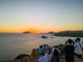 Tourists Watching Sunset at Cape Sounion