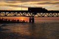 Tourists watching sunset by Lake Michigan under Mackinac Bridge, Mackinaw City, Michigan, USA Royalty Free Stock Photo