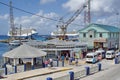 Tourists on a waterfront sidewalk on Grand Cayman