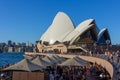 Tourists at waterfront Sydney Opera Bar in sunny day with beautiful blue sky and harbour bridge in Sydney