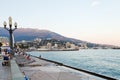 Tourists on waterfront in Yalta city in evening Royalty Free Stock Photo