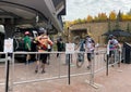 Tourists wearing mask and lining up to get inside the Snowmass lift ride