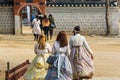 Tourists wearing traditional Korean clothes Hanbok at the Gyeongbokgung Gyeongbokgung Palace or Gyeongbok Palace, the main royal Royalty Free Stock Photo