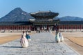 Tourists wearing traditional Korean Hanbok dresses in Gyeongbokgung Palace in Seoul capital of South Korea Royalty Free Stock Photo