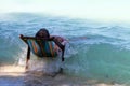 Tourists were sleeping and resting on the beach chairs At that moment a big wave suddenly hit him