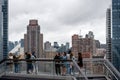 Tourists from Wessel looking at Manhattan landscape with residential and office buildings near Hudson Yards, New York, USA