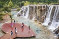 Tourists on the White Water River waterfall viewing platform in Blue Moon Valley. Royalty Free Stock Photo