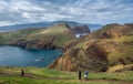 Tourists at wonderful hiking path in the mountains of Madeira.