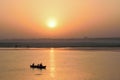 Tourists on wooden boats at Ganges river in Varanasi, India