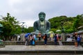 Tourists worshiping beautiful and famous giant bronze Buddha Sta