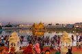 Tourists and worshipper walking inside the Golden Temple complex at Amritsar, Punjab, India, the most sacred icon and worship plac