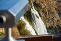 Touristy binoculars and a waterfall