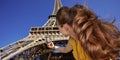 Young woman taking photo with camera while in Paris, France Royalty Free Stock Photo