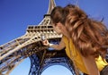 Young woman taking photo with camera while in Paris, France Royalty Free Stock Photo