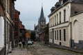 Tournai Doornik, Walloon Region - Belgium - View over an old paved street with the Saint John's church in the background
