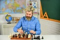Tournament play. thinking of attacking and capturing opponent chess pieces. thinking of next move. bearded man training