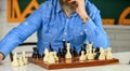 Tournament skills. chess figures on wooden board. Focused school teacher. thinking of attacking and capturing opponent Royalty Free Stock Photo