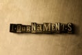 TOURNAMENTS - close-up of grungy vintage typeset word on metal backdrop