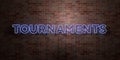 TOURNAMENTS - fluorescent Neon tube Sign on brickwork - Front view - 3D rendered royalty free stock picture