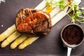 Tournedos Rossini. Foie gras, Black Angus beef tenderloin, white asparagus, red wine sauce. Delicious healthy Royalty Free Stock Photo