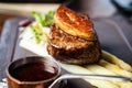 Tournedos Rossini. Foie gras, Black Angus beef tenderloin, white asparagus, red wine sauce. Delicious healthy Royalty Free Stock Photo