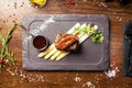 Tournedos Rossini. Foie gras, Black Angus beef tenderloin, white asparagus, red wine sauce. Delicious healthy Royalty Free Stock Photo