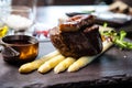 Tournedos Rossini. Foie gras, Black Angus beef tenderloin, white asparagus, red wine sauce. Delicious healthy Royalty Free Stock Photo