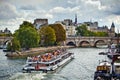 Toursit boat navigation on Seine river in Paris, France