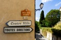 Toutes Directions and Centre Ville signs in the South of France village of Grimaud, Var, France