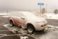 A tow-car crusted with ice in wyoming in the springtime