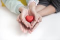 Tow child holding red heart, closeup. Adoption concept Royalty Free Stock Photo