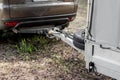 Tow hitch on a car. Trailer drawbar with spare wheel