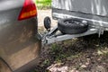 Tow hitch on a car. Trailer drawbar with spare wheel Royalty Free Stock Photo