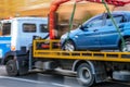 Tow truck delivers the damaged vehicle