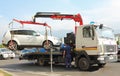 A tow truck loads the car for evacuation.