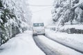 Tow truck on a snow covered road. Road assistance Royalty Free Stock Photo