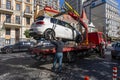 Tow truck takes away a wrongly parked car on central street in Kyiv, Ukraine. Violation of the traffic rules. Evacuating a car