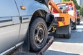 Tow truck towing a broken down car in emergency