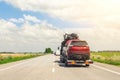 Tow truck trailer on highway carrying three damaged cars sold on insurance car auctions for repair and recovery.  Vehicles Royalty Free Stock Photo