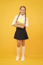 Towards knowledge. small girl in school uniform. dictionary notebook. Get information. reading story. childrens Royalty Free Stock Photo