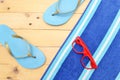 Towel and beach slippersBeach slippers, towel and sunglasses Royalty Free Stock Photo