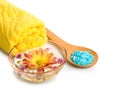 Towel, Blue bath salt and flowers in bowl Royalty Free Stock Photo