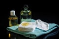 Towel, Bottle of Oil, and Table Royalty Free Stock Photo