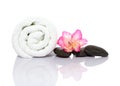 Towel, gladiola and pebbles for massage Royalty Free Stock Photo