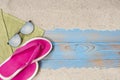 Towel glasses and slippers on the beach for summer background Royalty Free Stock Photo