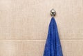 Towel for hands hanging on a rack in the bathroom. Royalty Free Stock Photo