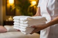 Towel placement Hotel maids hands close up, ensuring neat bed display