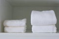 Folded towels on shelf