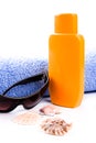 Towel, shells, sunglasses and lotion Royalty Free Stock Photo